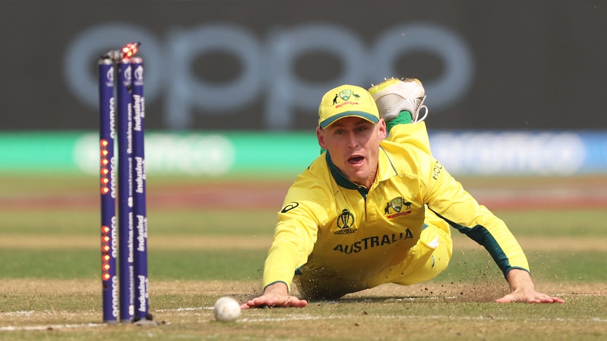 Australia's Marnus Labuschagne is full-length as he stares at the stumps as the bails light up after his throw for a run-out.