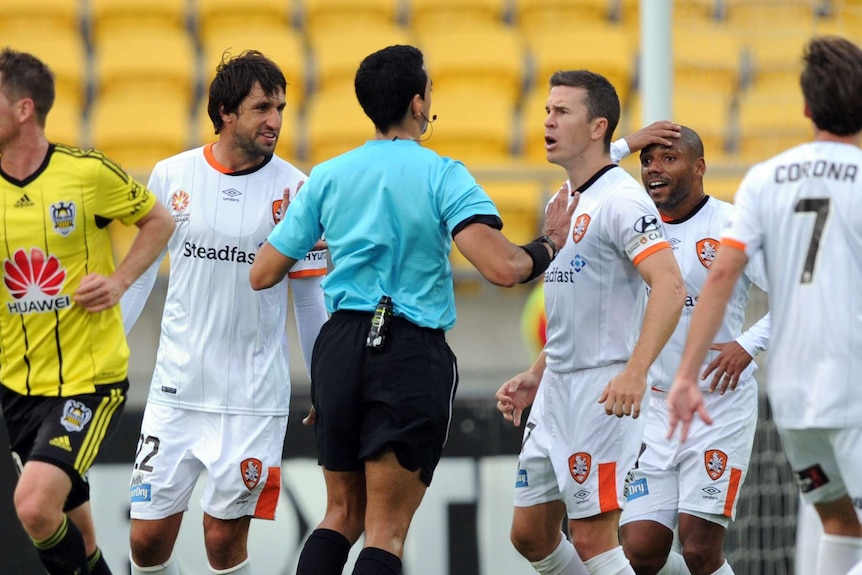 Thomas Broich and Matt McKay argue with the referee