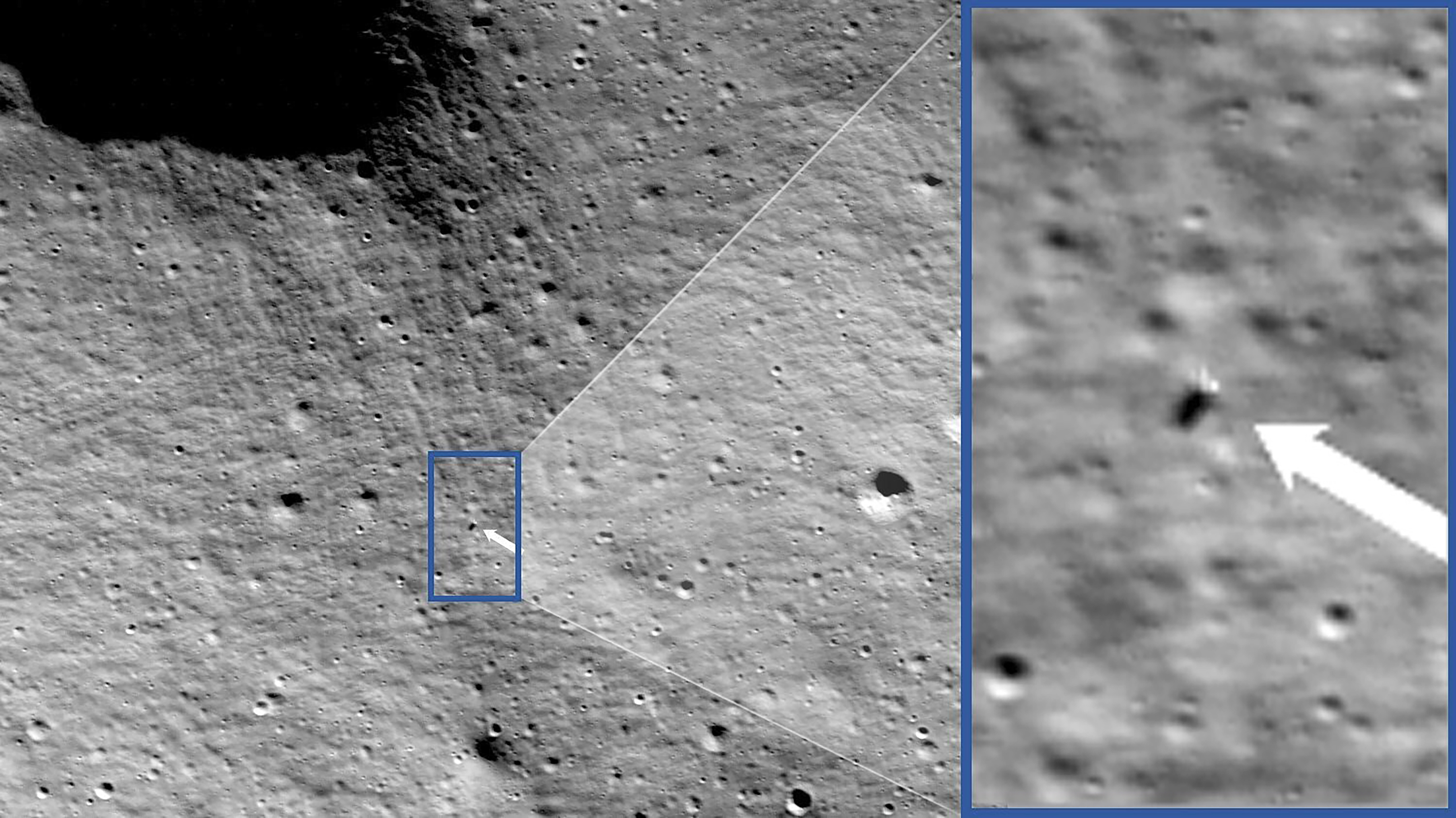 A wide satellite photo of the surface of the Moon showing with an arrow the location of a lunar lander