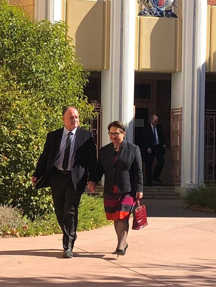 Former Liberal MP Sophie Mirabella leaves court with her husband.