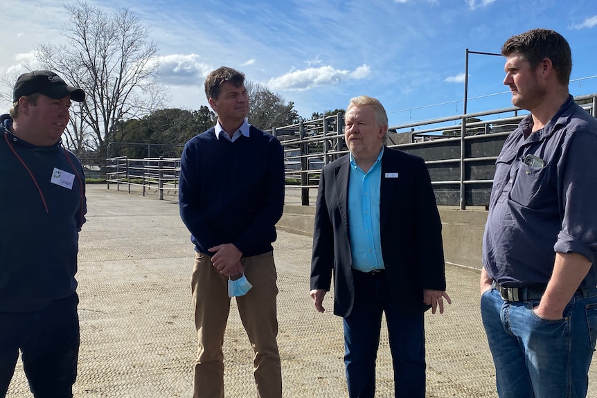 Angus Taylor with farmers. 