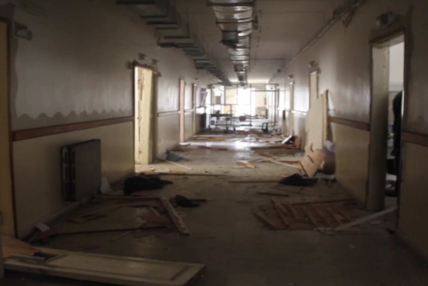 Bomb damage in a corridor of the Ma'aret Al Numan hospital in Idlib