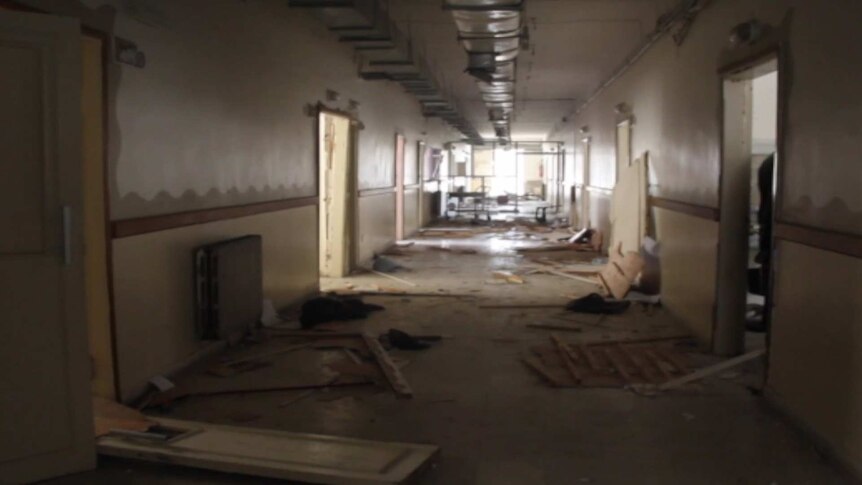 Bomb damage in a corridor of the Ma'aret Al Numan hospital in Idlib