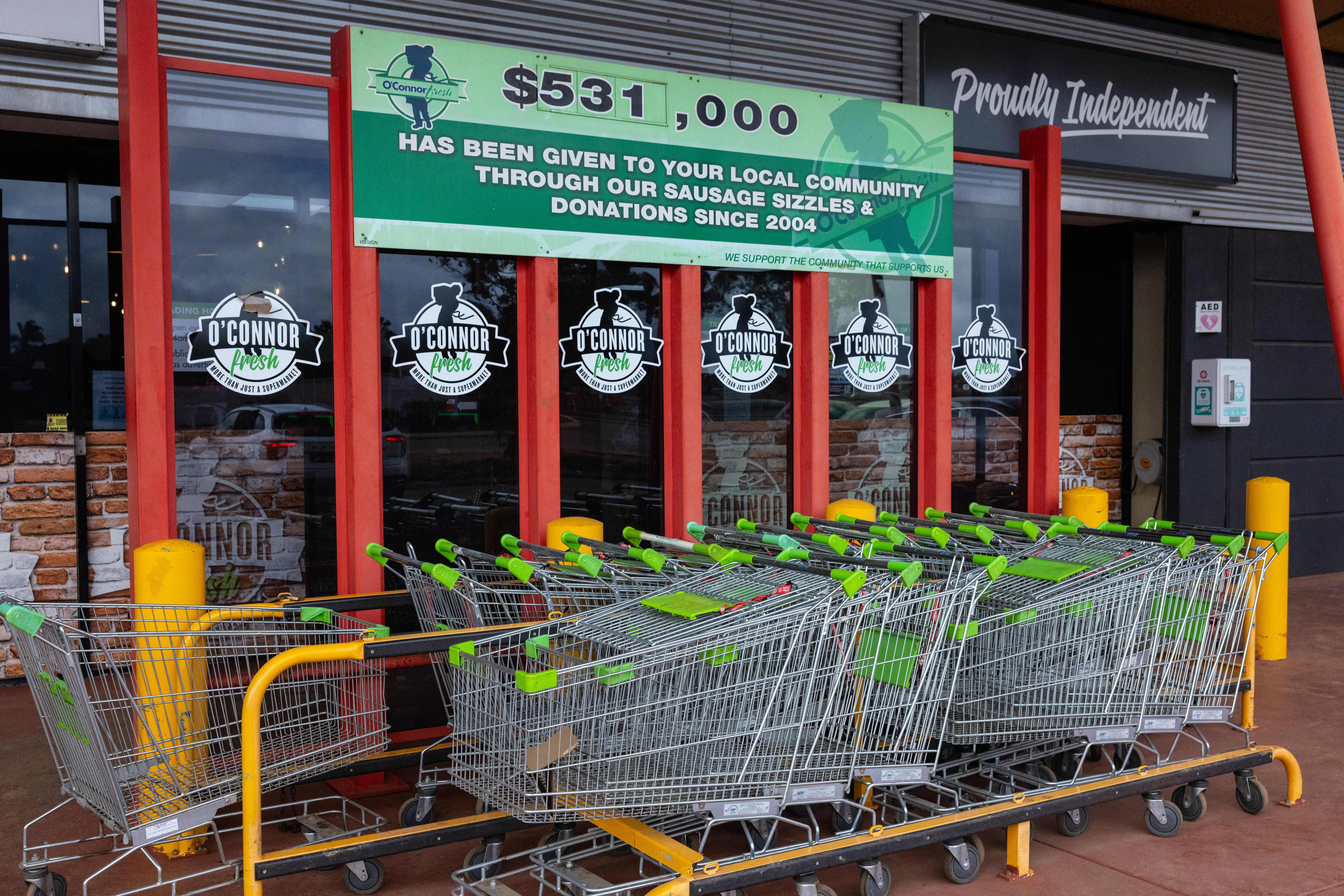 Shopping carts at the entrance to a supermarket.  