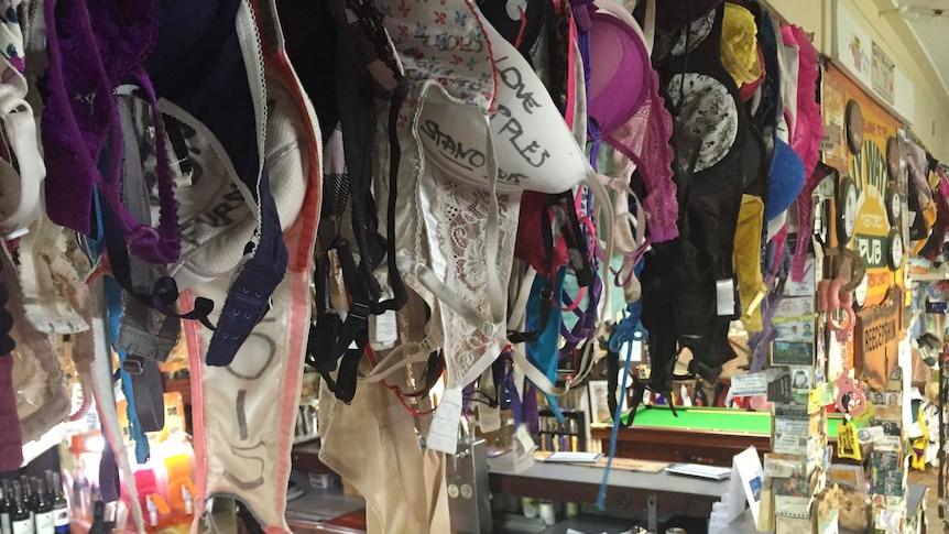 Bras hang from ceiling of pub