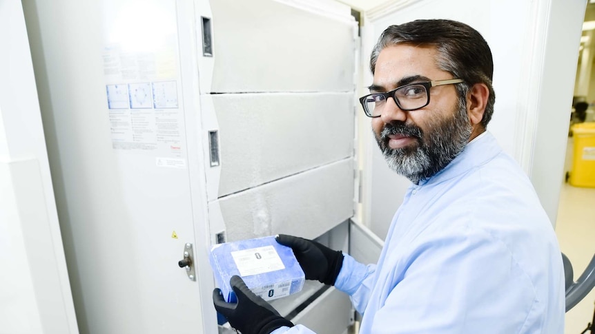 Scientist holds frozen blood package
