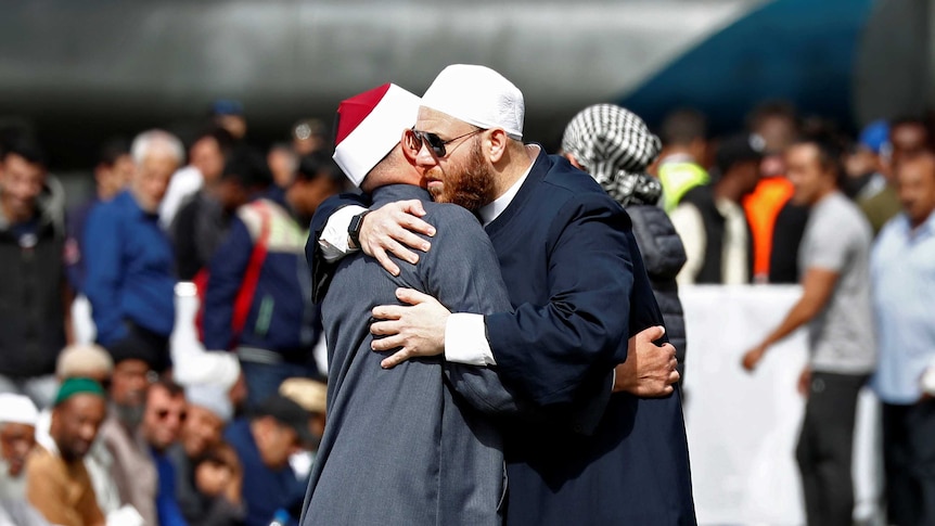 People react during Friday prayers at Hagley Park outside Al-Noor mosque in Christchurch, New Zealand March 22, 2019. 