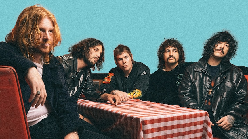 Sydney band Sticky Fingers sit at a diner table