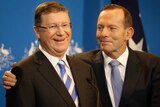 Tony Abbott hugs Denis Napthine
