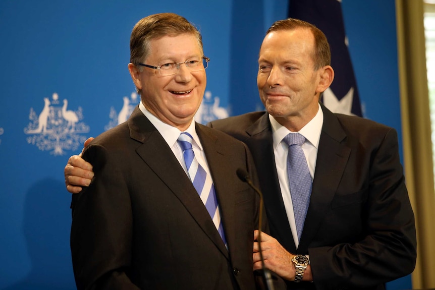 Tony Abbott hugs Denis Napthine