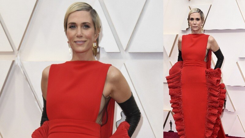 A composite image of Kristen Wiig wearing a red structured dress with wide fringing on the side.