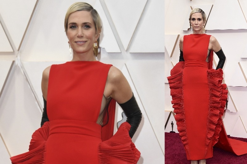 A composite image of Kristen Wiig wearing a red structured dress with wide fringing on the side.