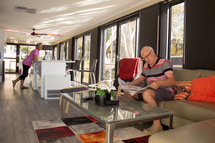 Ron and Lin Davison inside the open-plan living area of their houseboat.
