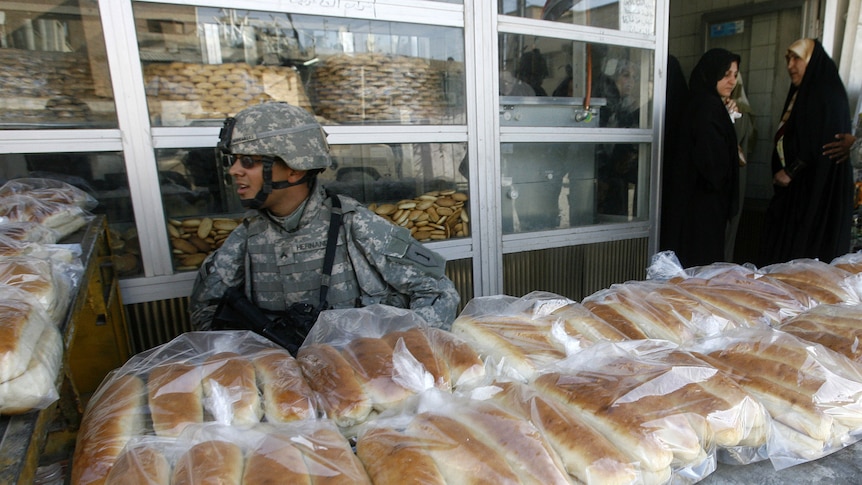 Doubts over surge: A US soldier on patrol near Baghdad