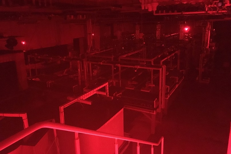 SeaSim's main room glowing under eerie red lights at night