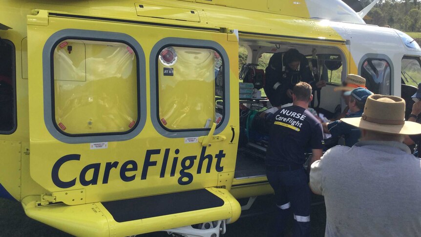 Josh Ball and the Careflight crew tend to a patient during the Easter long weekend