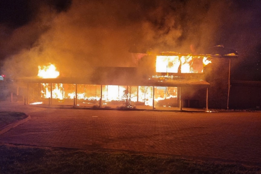 Fire engulfs a building.