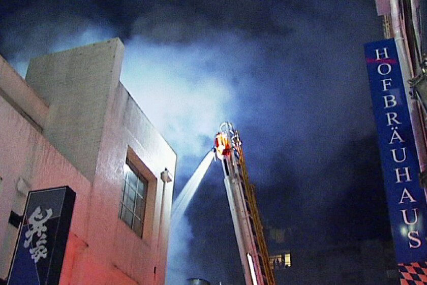 Fire crews tackle a Chinatown blaze in Melbourne
