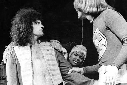 Three actors on stage in Hair