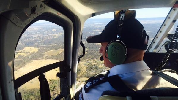 Victoria's Emergency Management Commissioner Craig Lapsley assesses bushfire damage.