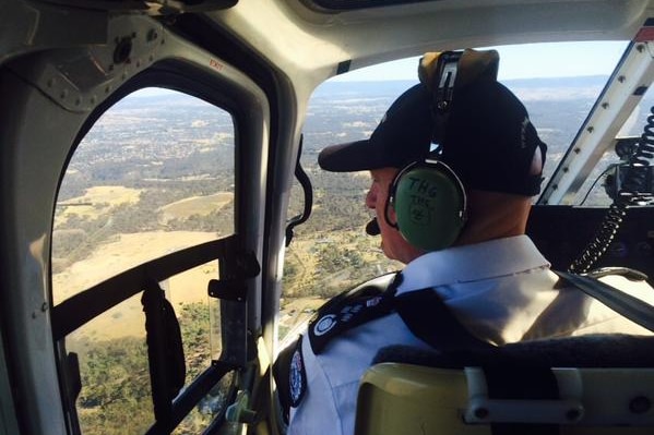 Victoria's Emergency Management Commissioner Craig Lapsley assesses bushfire damage.