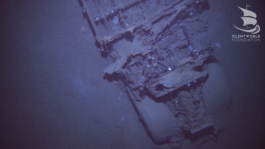 The remains of a truck at the bottom of the ocean.