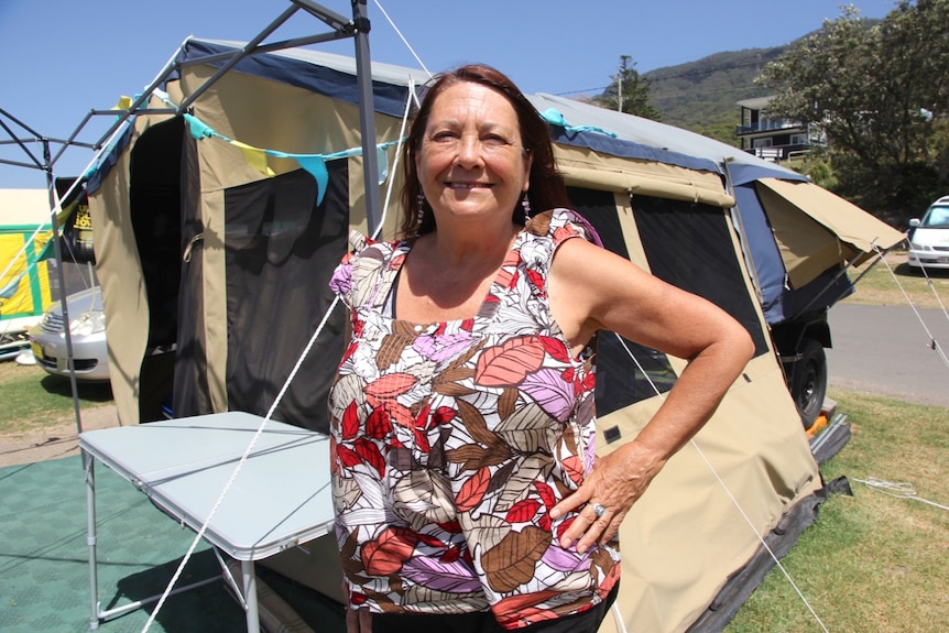Joanne Fletcher stands in front of her camper trailer in the Coledale camping reserve