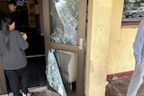 The doors of the Todd Tavern are seen smashed.