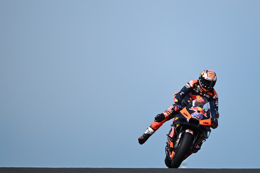 Jack Miller sticks his leg out while riding his bike in the MotoGP practice session at Phillip Island.