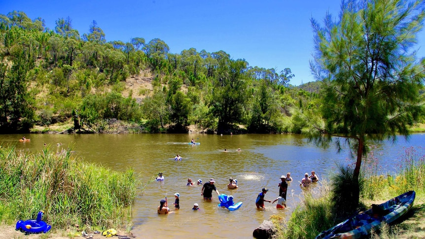 People swimming in the Murrumbidgee River in the ACT.