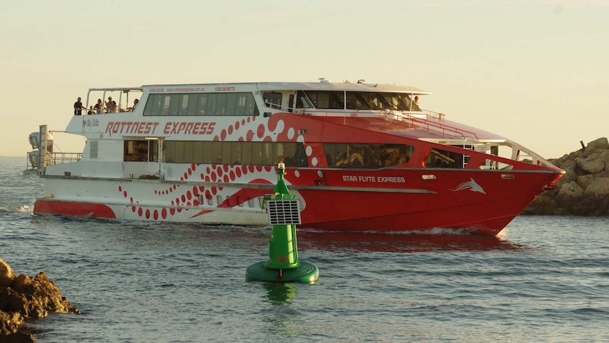 A Rottnest Island ferry carrying Vasco da Gama cruise ship passengers pulls into Fremantle.