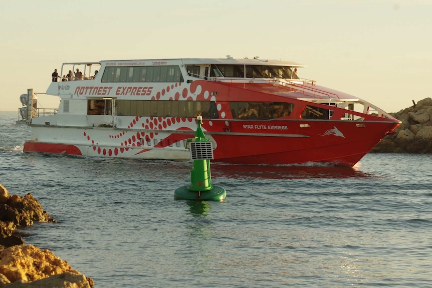 A Rottnest Island ferry carrying Vasco da Gama cruise ship passengers pulls into Fremantle.