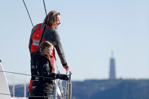 Climate change activist Greta Thunberg pictured with her father aboard the yacht La Vagabonde at Santo Amaro port in Lisbon.