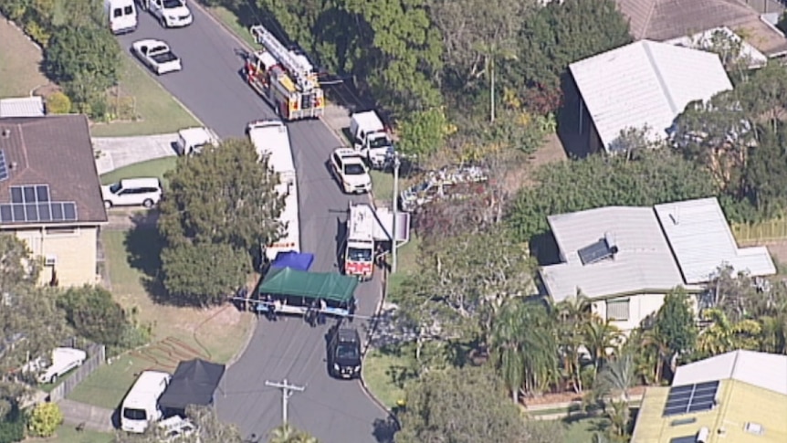 Police and fire crews at the scene of the Burpengary home.