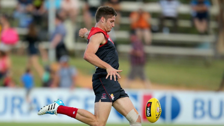 The Demons' Jesse Hogan kicks a goal in the 2014 pre-season match against Geelong in Darwin.