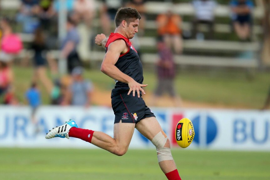 The Demons' Jesse Hogan kicks a goal in the 2014 pre-season match against Geelong in Darwin.