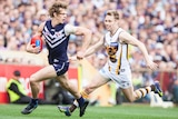 Fremantle's Nat Fyfe runs with the ball against Hawthorn at Subiaco Oval