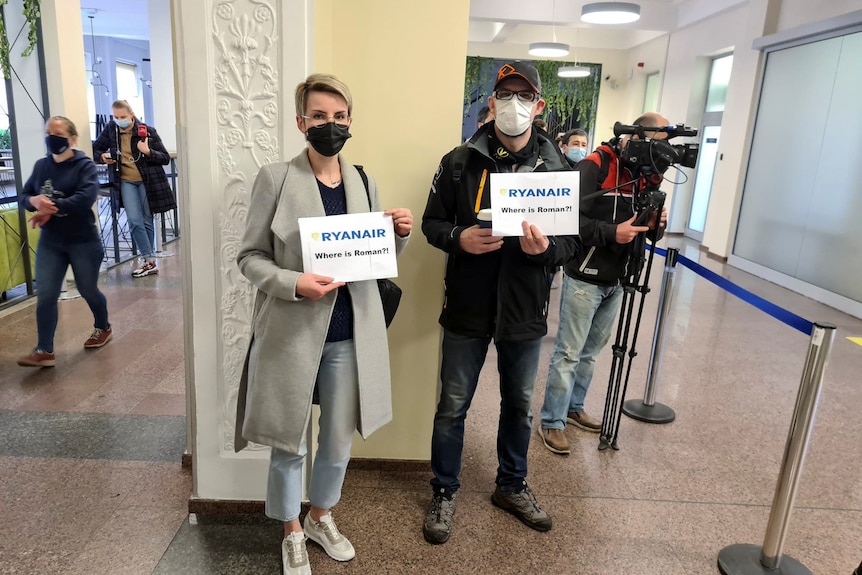 Supporters of the Belarusian dissident Roman Protasevich wait at Vilnius airport for the diverted Ryanair flight