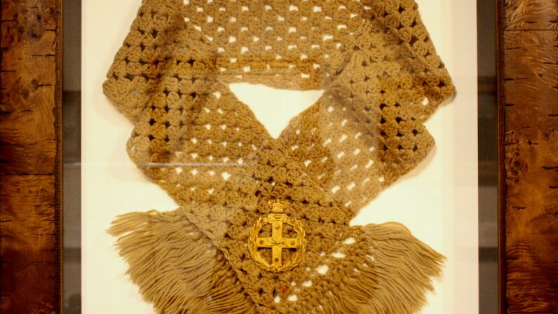 The Queen's Scarf presented to Private Alfred du Frayer on display at the Australian War Memorial.