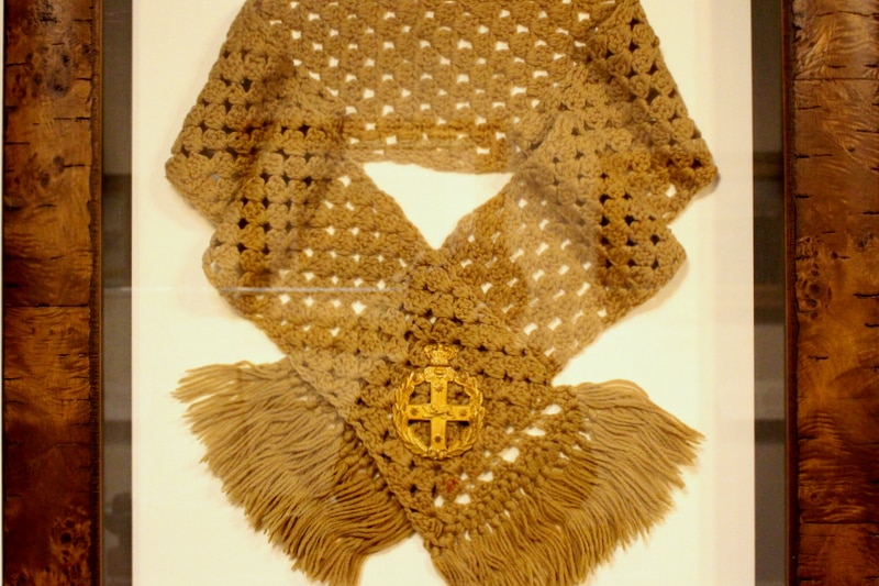 The Queen's Scarf presented to Private Alfred du Frayer on display at the Australian War Memorial.