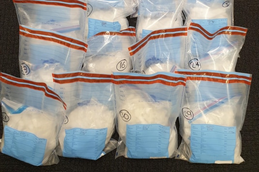 A pile of bags containing a white powder
