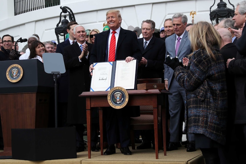 S President Donald Trump shows off the United States-Mexico-Canada Trade Agreement