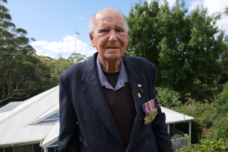 99 year old Second World War veteran, Jack Bartlett wearing his medals outside his Avoca Beach home. 