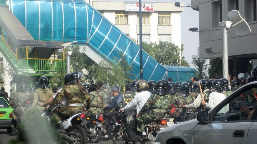 A militia bike squad make their way through the streets of the Iranian capital of Tehran