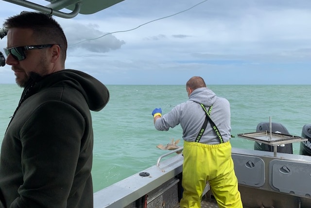 Two men on a fishing boat