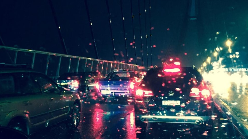 Sydney's Anzac Bridge in gridlock amid storm.