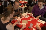 Four competitors play bridge at the festival.