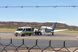 Woman injured in alleged assault loaded into a RFDS plane