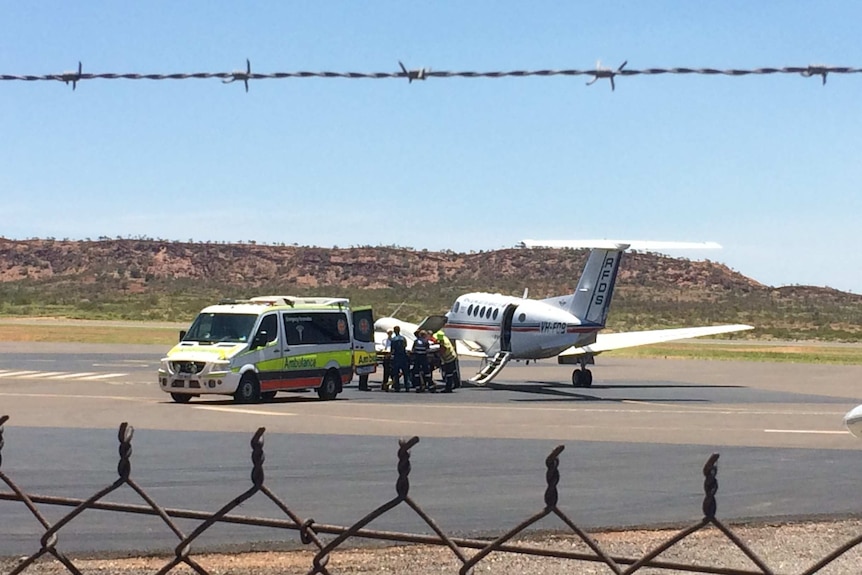 Woman injured in alleged assault loaded into a RFDS plane
