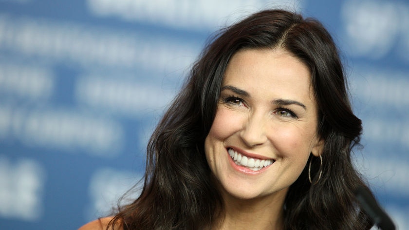 Landscape headshot of Demi Moore smiling.